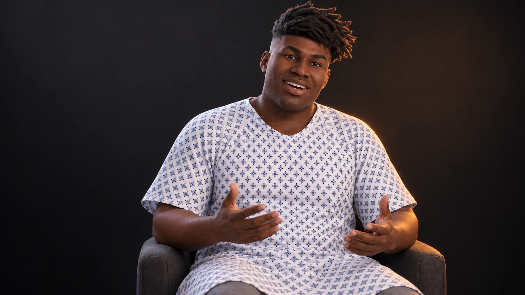 A seated Xuron virtual human in a patient gown, with an engaged expression and both hands open