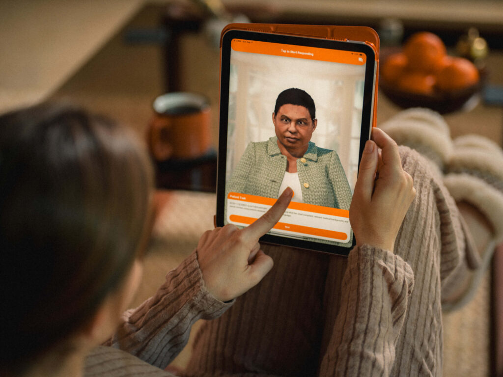 Instructor reviewing real-time learner performance data on tablet during simulation